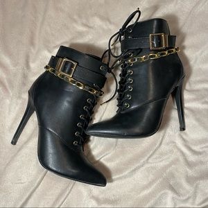 Black heeled ankle boots zip up, laces and chain detail